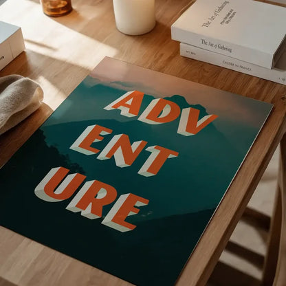 Bold "ADVENTURE" typography print with orange 3D letters over a teal mountain and pink sky background.