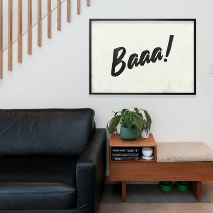 Minimalist "Baaa!" animal sound print with black brush script on a textured off-white background in a black frame.