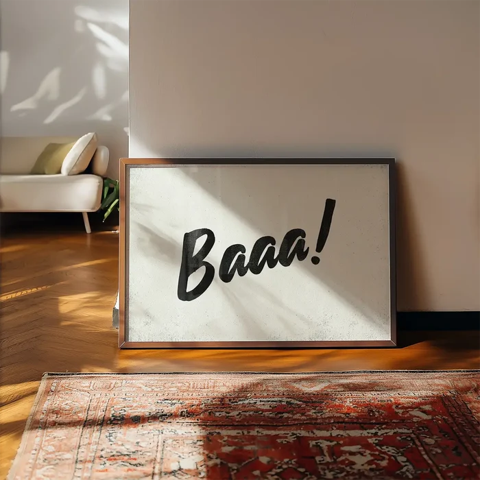 Minimalist "Baaa!" animal sound print in black brush script on a light background, framed in wood, leaning on a wall.
