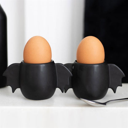 bat wing egg cup set shown holding eggs with playful gothic kitchen styling