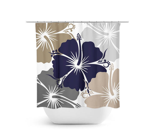 A shower curtain featuring a modern design with blue, gray, and tan hibiscus flowers on a white background, with a visible white shower curtain liner.