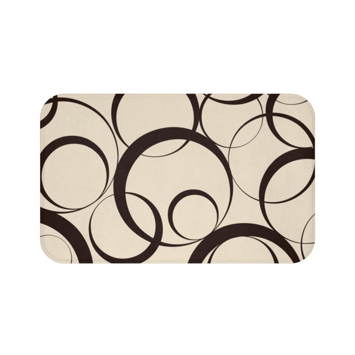 Floor mat with brown rings against a beige background.