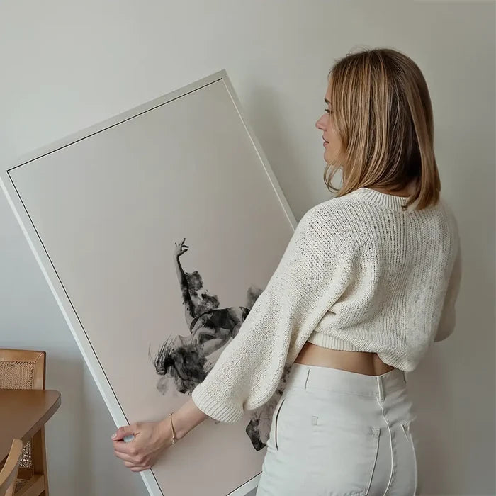 Abstract female dancer in cloud formations on pastel pink background, framed art print.