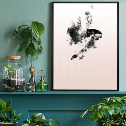 Abstract female form dancing in clouds on a pastel pink art print, framed in black, on a green shelf.