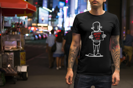 Man in Down To The Wire Shirt by ChrisRWK with cartoon character, holding sign, street fashion details.