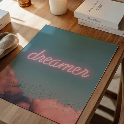 Dreamer Clouds Neon Print: Pink neon "dreamer" text over a blue sky with pink clouds and birds.