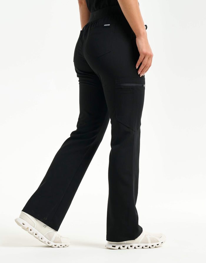 right with hip pocket of black flare scrub pants