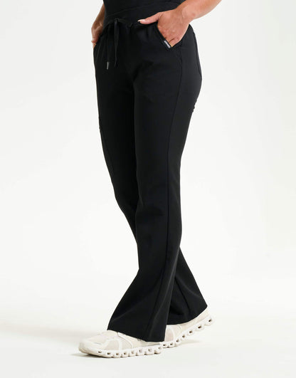 left with thigh pocket of black flare scrub pants