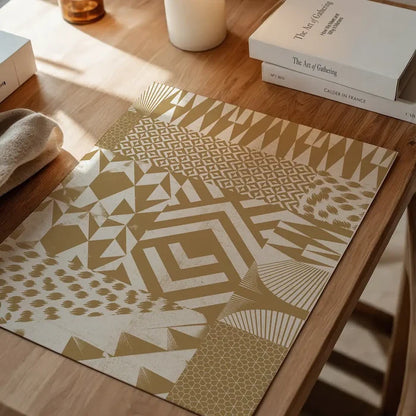 Abstract geometric segments gold print on archival art paper, displayed on a wooden table.