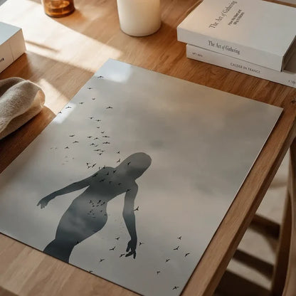 Striking graphic print of a female silhouette with a flock of birds against a cloudy sky, on archival art paper.