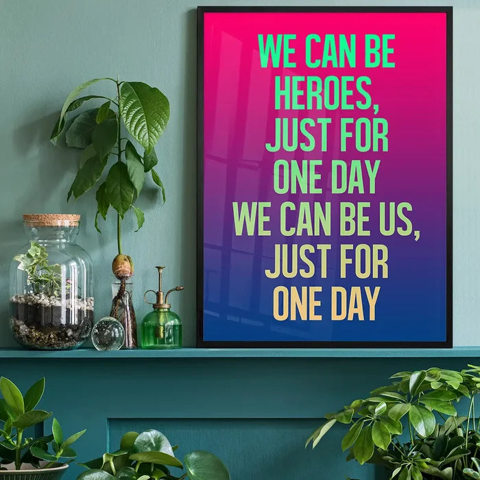 Neon pink, purple, and blue gradient print with "WE CAN BE HEROES" lyrics in green and yellow.