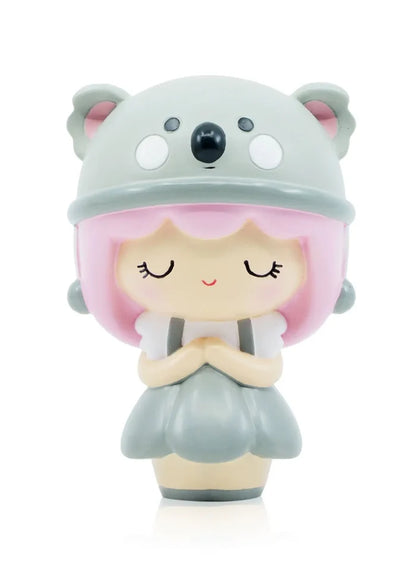Toy figurine of a girl in koala garment, inspired by hugs. Momiji doll with unique design and hidden message feature.