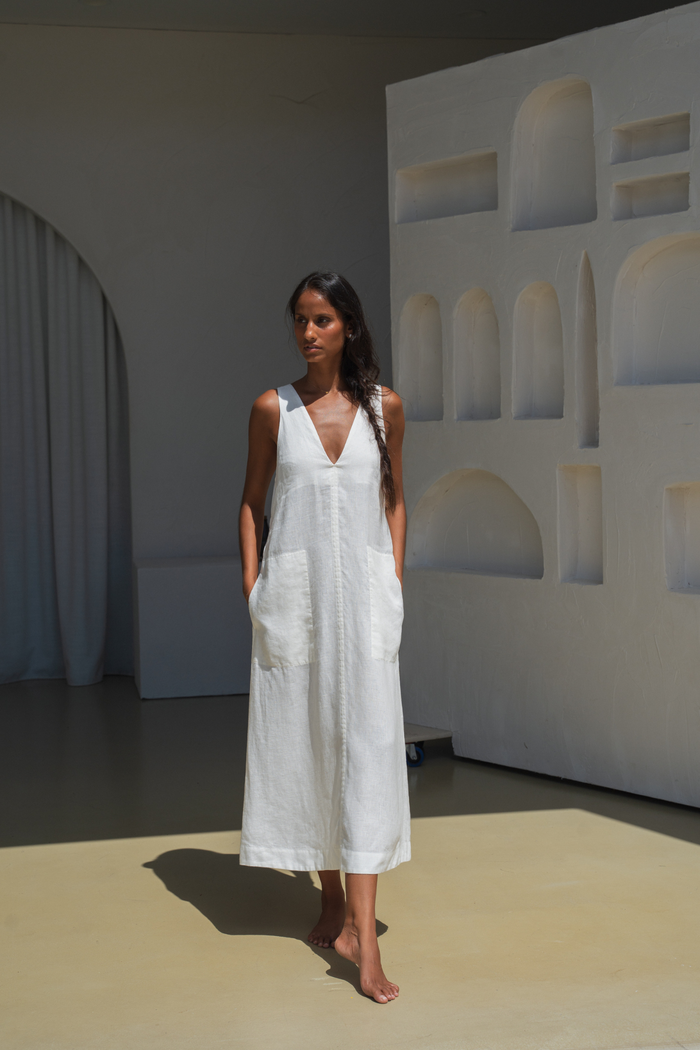 Model wearing Lilly Pilly LP-D018 Iris Linen Dress Ivory by Lilly Pilly, shop the brand at Dotique for elegant style.