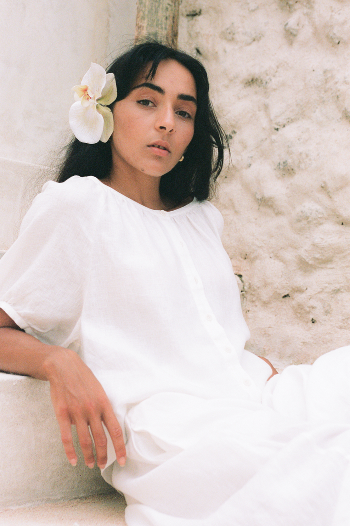 Woman wearing Lilly Pilly LP-T008 Pia Linen Top Ivory by Lilly Pilly, shop Lilly Pilly at Dotique for stylish apparel.