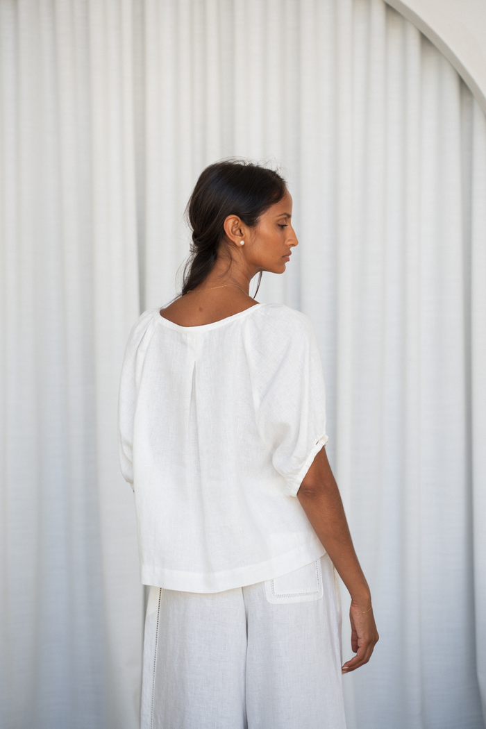 Woman wearing Lilly Pilly LP-T008 Pia Linen Top Ivory by Lilly Pilly, shop the brand now at Dotique.