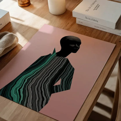 Abstract female form print with black head and green marble texture body on a pink background.
