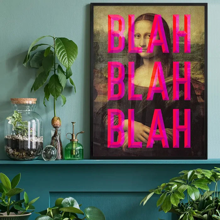 Framed Mona Lisa print with bold pink "BLAH BLAH BLAH" typography, displayed on a teal shelf with plants.
