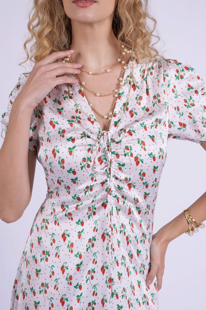 Close-up of ruched front and strawberry print on New Day Originals Babbington Strawberries & Cream Dress, shop New Day Originals at Dotique
