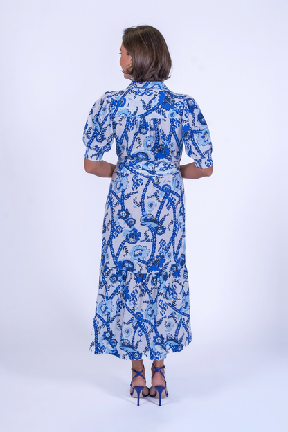 Back view of woman wearing New Day Originals Safari Blue Shirt Dress by New Day Originals, shop the vendor at Dotique.