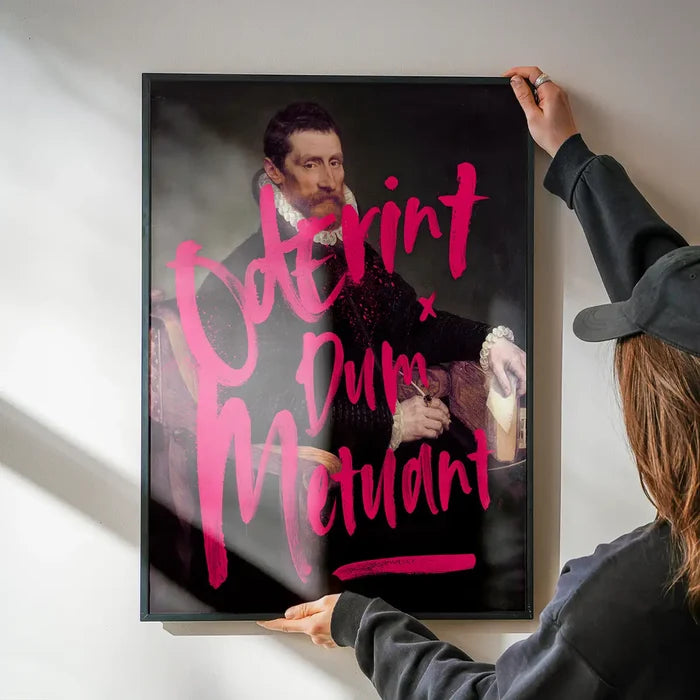 Framed "Oderint Dum Metuant" graffiti print on art paper, featuring a classic portrait with bold neon pink text.