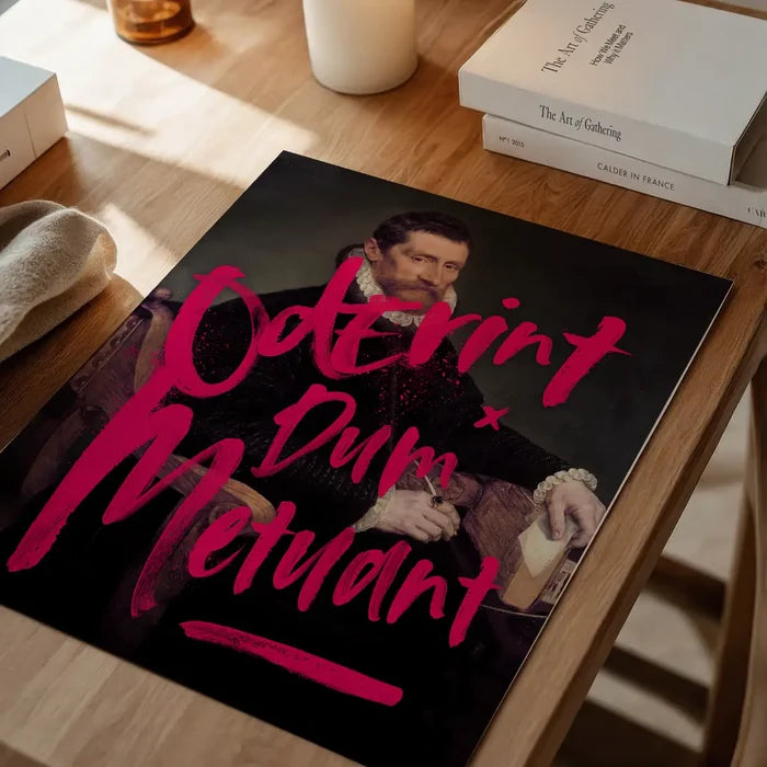 Bold neon pink graffiti "Oderint Dum Metuant" over a dark Renaissance portrait print on wood.