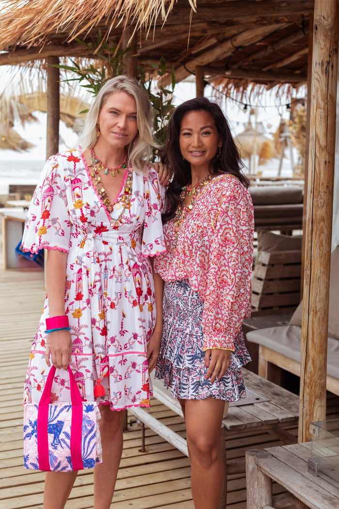 Model wearing Place Du Soleil Birdhouse Print Short Dress S26-407 by Place du Soleil, shop Dotique for chic summer looks