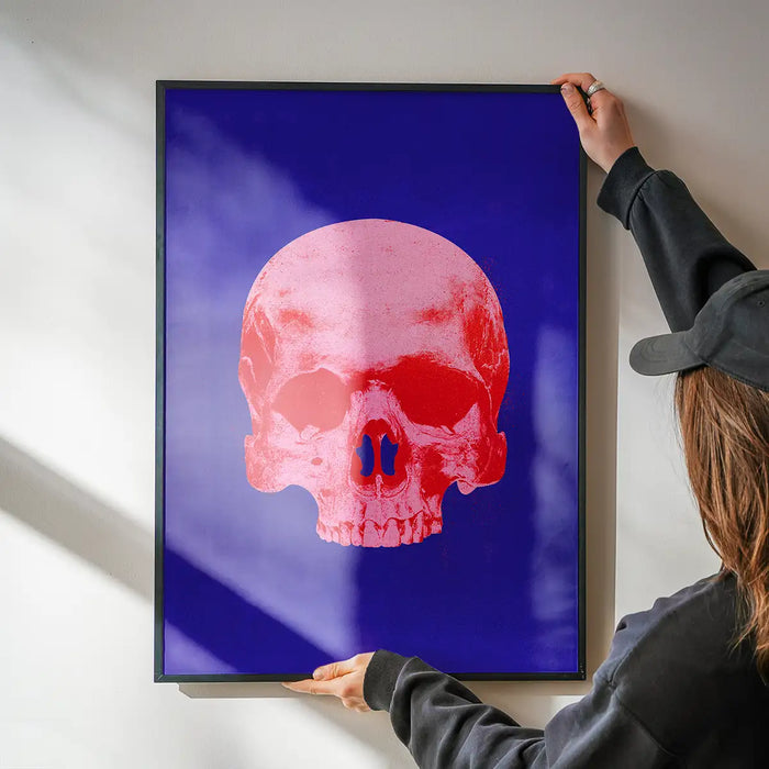 Pop Art Warhol style blue and pink skull print on 250gsm art paper, held by hands.