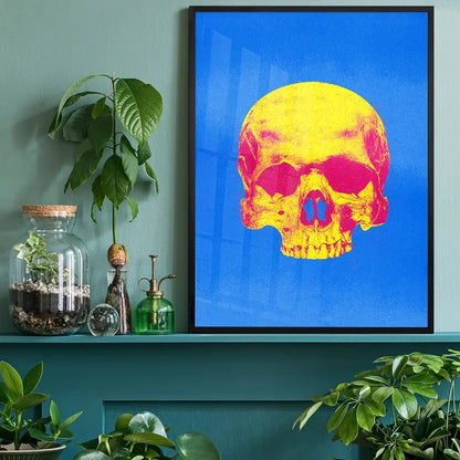 Pop Art Warhol style blue and yellow skull print on art paper, framed and displayed on a shelf.