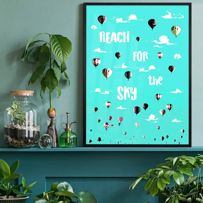 Bright turquoise "Reach For The Sky" print with colorful hot air balloons and white clouds in a black frame.