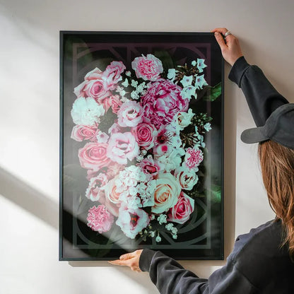 Framed "Roses Geometric Print" art, featuring pink and white roses with bold geometric lines on dark archival paper.