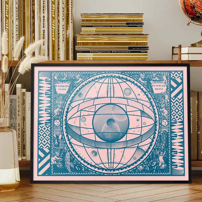 Pink and teal vintage-style astrology print with an eye design in a black frame.