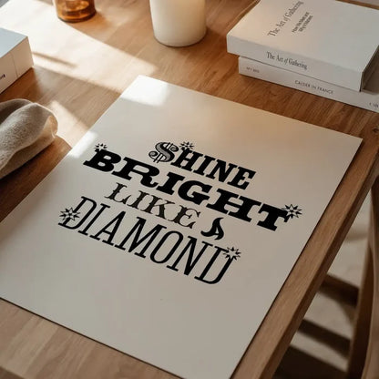 Shine Bright Like a Diamond" typographic print on archival art paper, displayed on a wooden table.