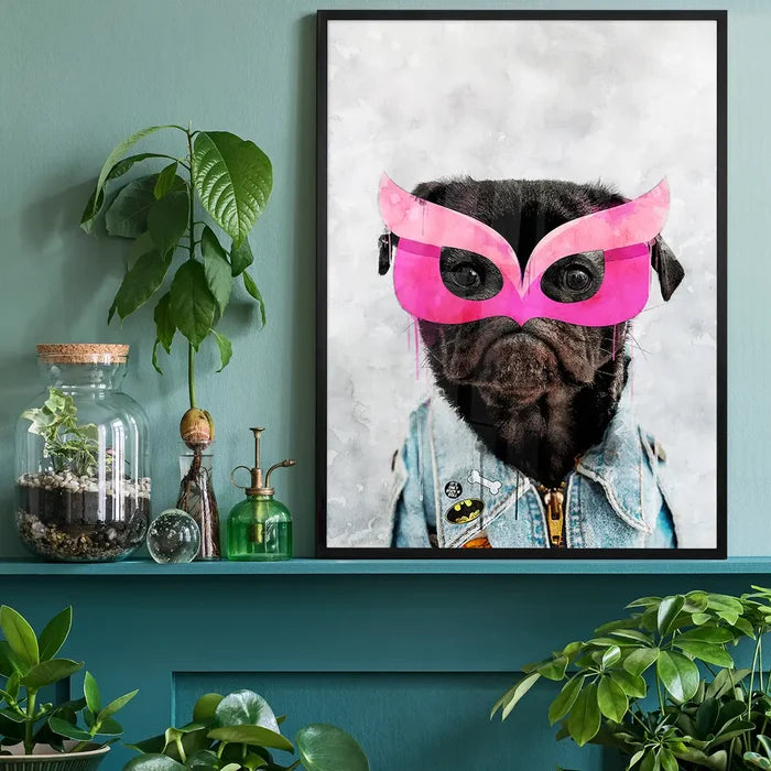 Watercolor art print of a black pug in a pink superhero mask and denim jacket, framed on a green shelf.