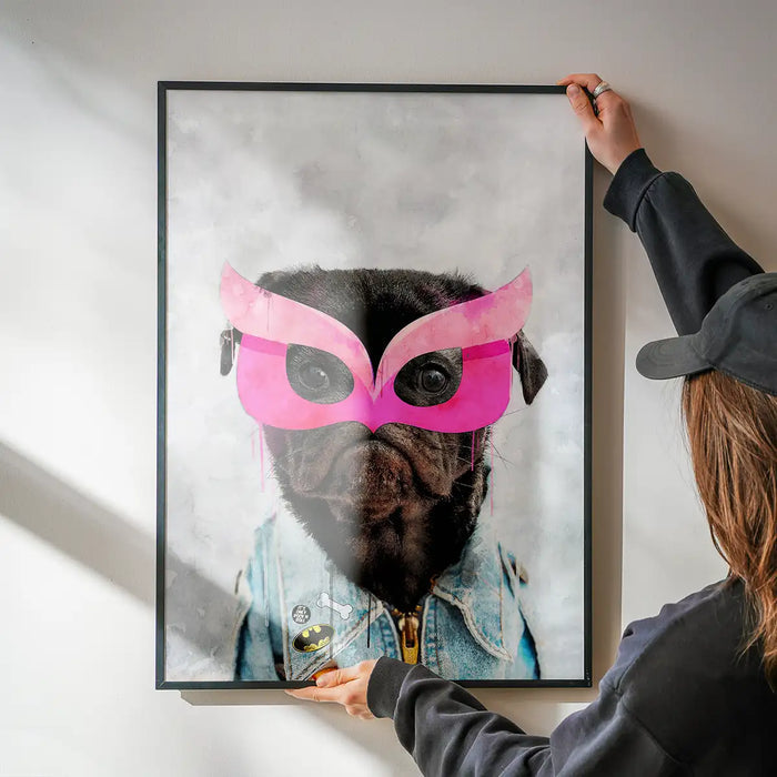 Watercolor pug puppy in a pink superhero mask and denim jacket art print, held by hands.