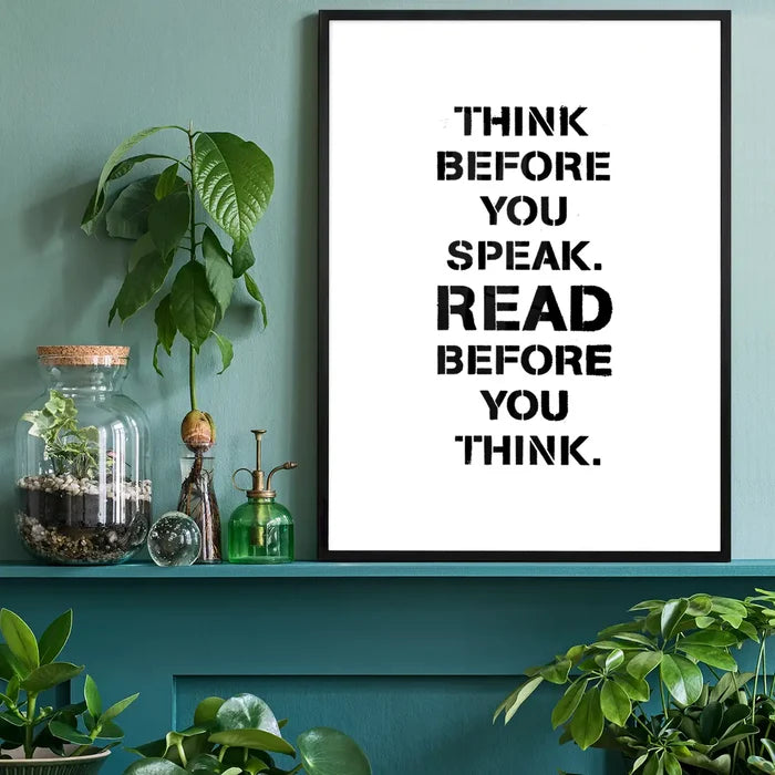 Black framed typographic print on white paper: "Think Before You Speak. Read Before You Think.