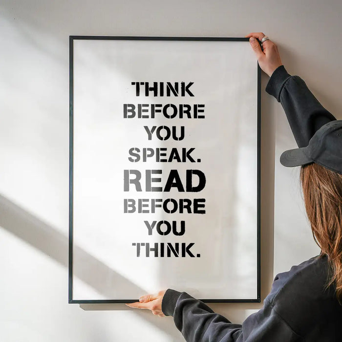 Black framed "Think Before You Speak. Read Before You Think." typographic print on white archival paper.