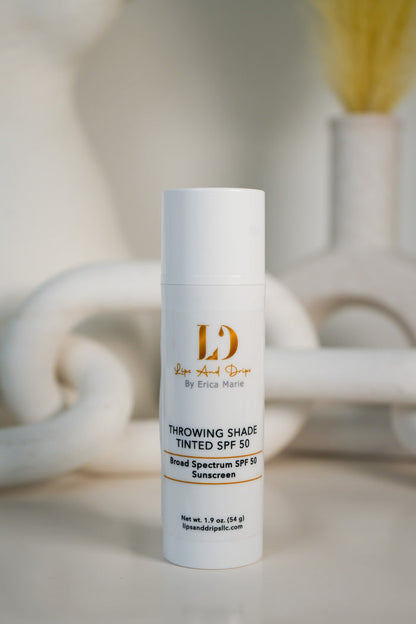 Lips & Drips Throwing Shade Tinted SPF 50 bottle front view broad spectrum sunscreen