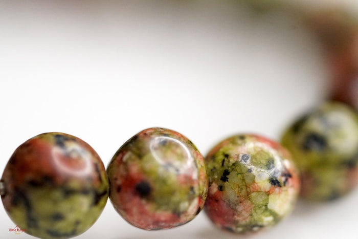 Unakite is said to be a stone of vision, opening the third eye and useful for scrying. It is also believed to be a stone of balance, grounding the self while bringing emotions and spirituality together.