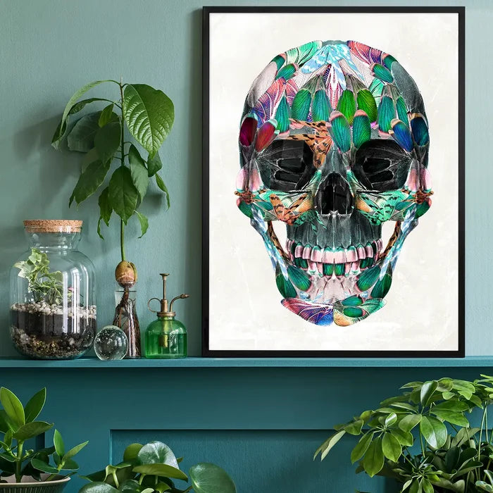 Framed White Wings Skull Print, a vibrant anatomical skull made of colorful butterfly wings on white art paper.