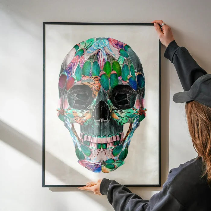 Framed White Wings Skull Print, a vibrant anatomical skull made from colorful butterfly wings.